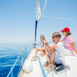 Boy,With,His,Sister,And,Mother,On,Board,Of,Sailing