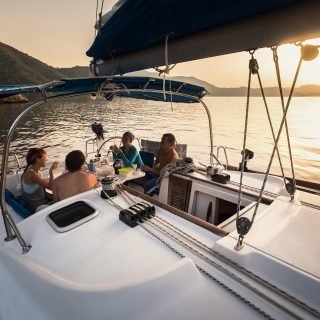 Group,Of,Young,People,Have,A,Dinner,In,Anchored,Yacht